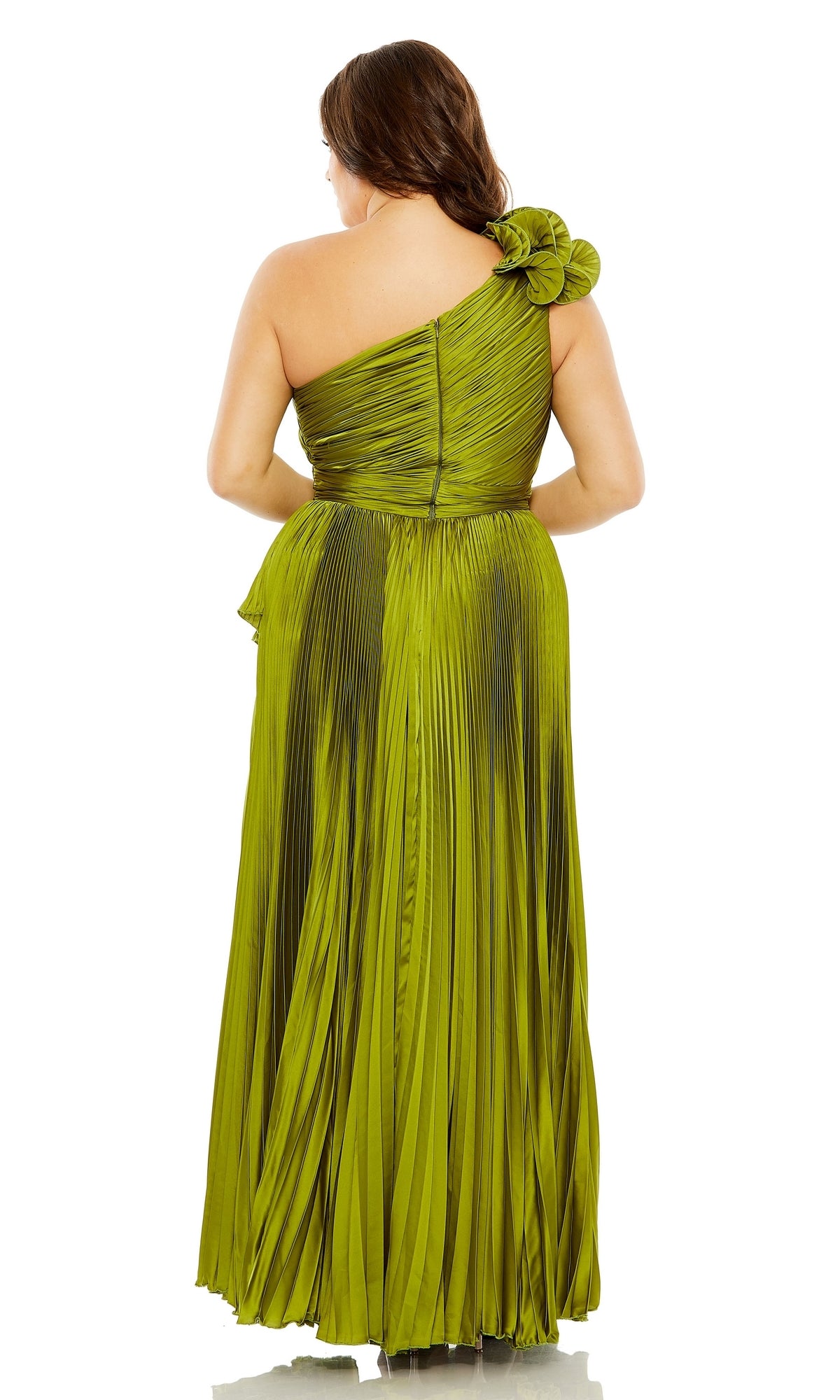 A woman is photographed from the back in the Long Plus-Size Formal Dress 77003 by Mac Duggal, an olive green, pleated, floor-length A-line gown with one shoulder and a floral strap detail that highlights its elegant design.